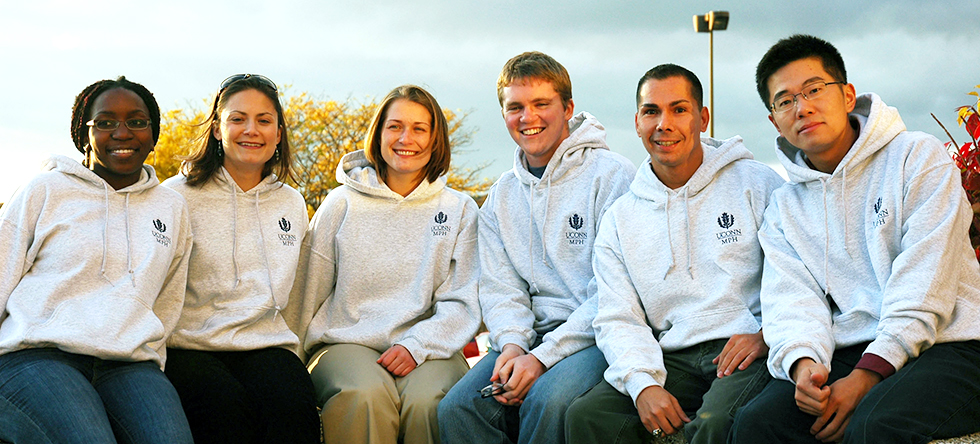 Picture of MPH Students sitting outside with MPH sweatshirts